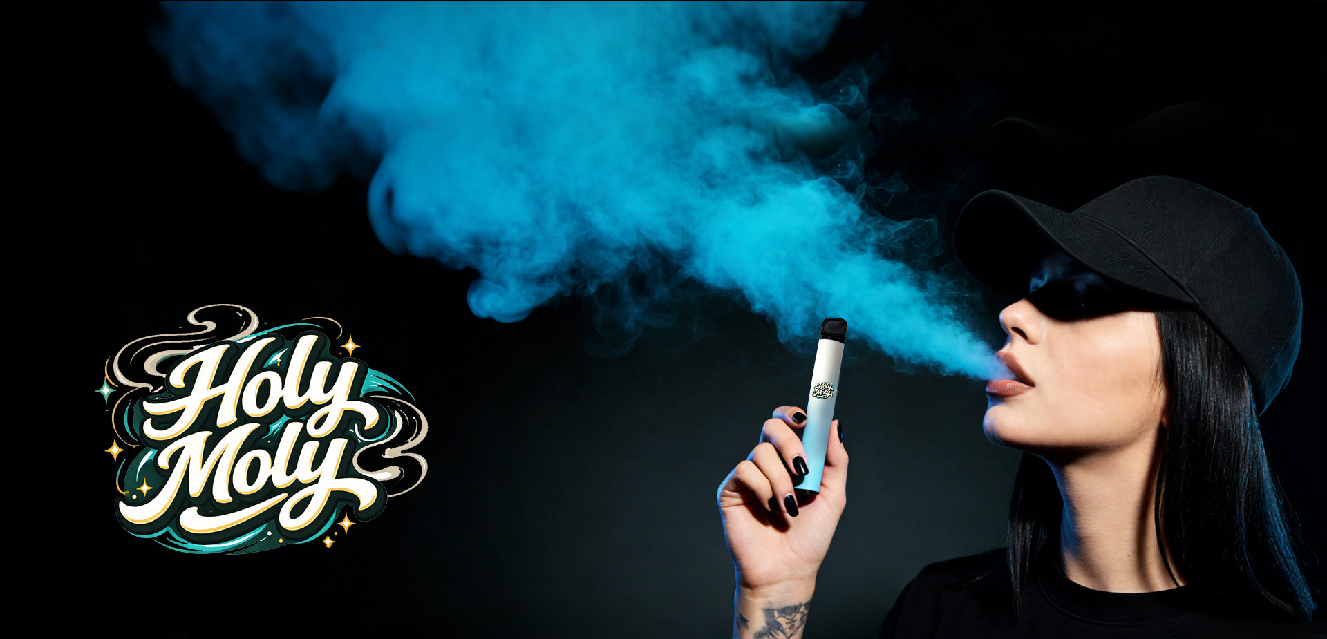 Woman with a black cap and black nails holding a large blue HOLYMOLY Melatonin herbal diffuser while exhaling bright blue aromatic vapor against a dark background