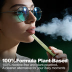 Young woman with clear-lens glasses using a green HOLYMOLY Mullein plus Thyme herbal diffuser with white aromatic vapor